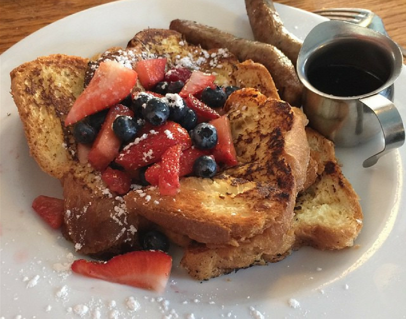 Smoked toast with maple syrup, strawberries, and blueberries