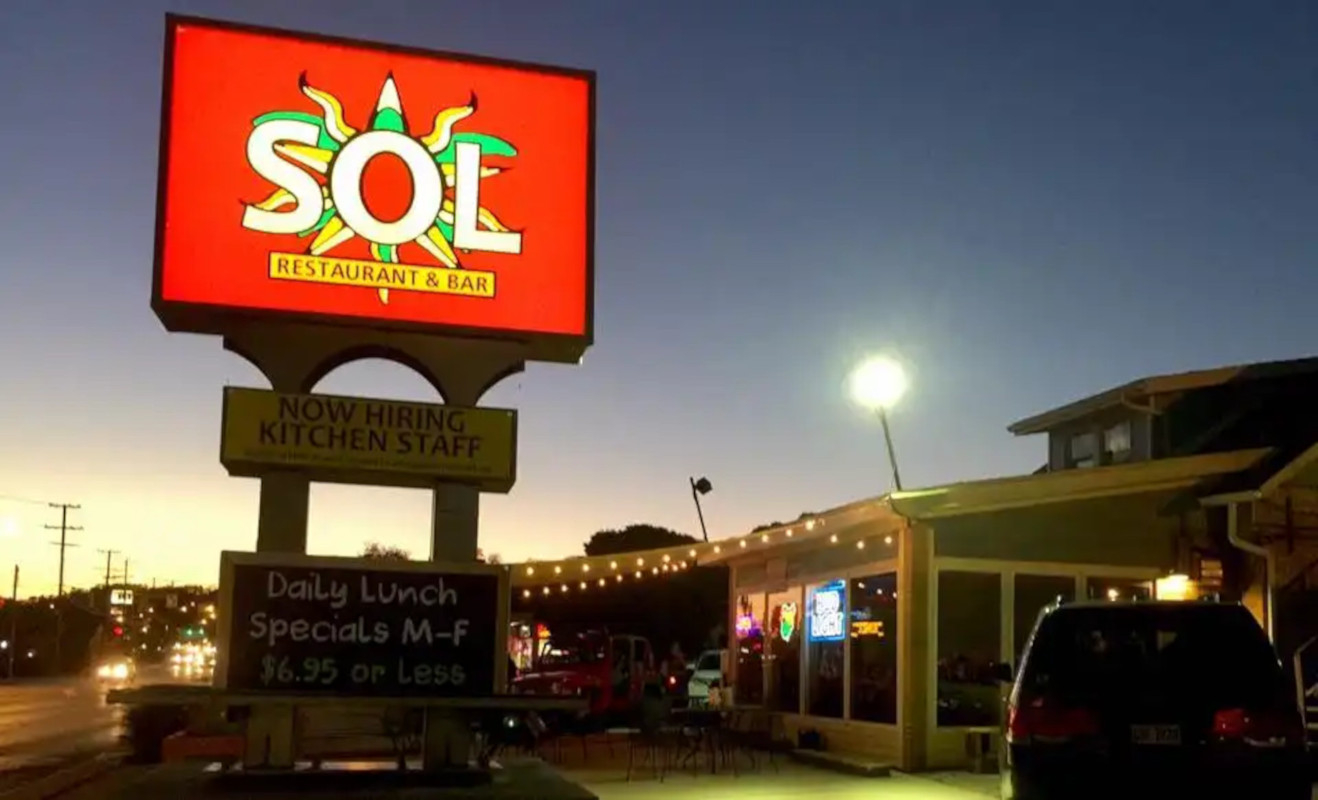 The Sol Restaurant sign at night